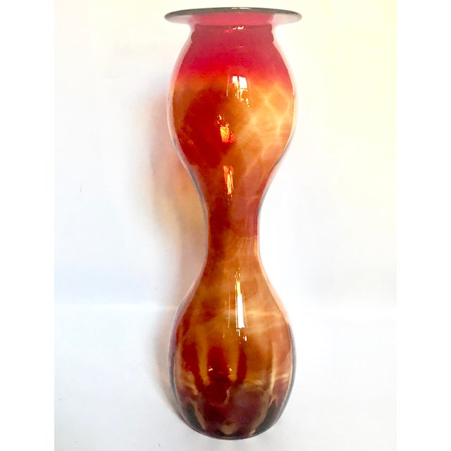Dramatic Blenko Glass Company #2129 floor vase in glowing Amberina glass, an impressive 19-inch example of this sculptural...