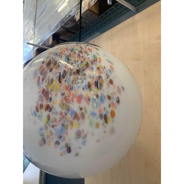 Contemporary elegant milky-white sphere in Murano glass with multicolored Murrine. Floeal design in very particular and...