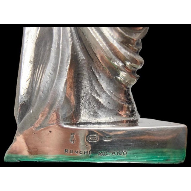 Sculpture of venus in solid silver Elegant sculpture of the roman goddess Venus on a malachite pedestal. The sculpture is...
