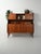 Scandinavian teak sideboard from the 1950s. Central drawers with recessed handles, spacious two-level storage, and an...