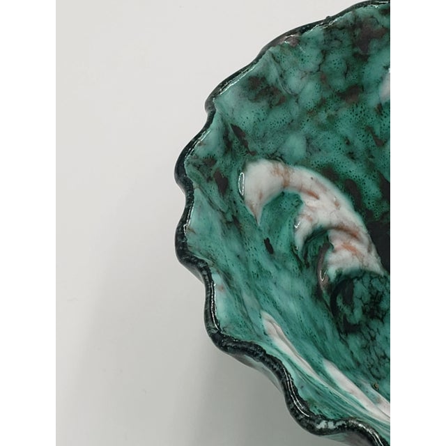 This gorgeous, hand-crafted pottery bowl/basket features a teal and white glaze on red clay, creating a striking variation...