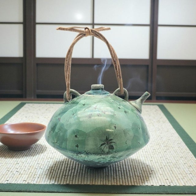 An early crystalline glaze studio teapot by American ceramicist Jack Boydston, bearing an incised early “JB” signature...