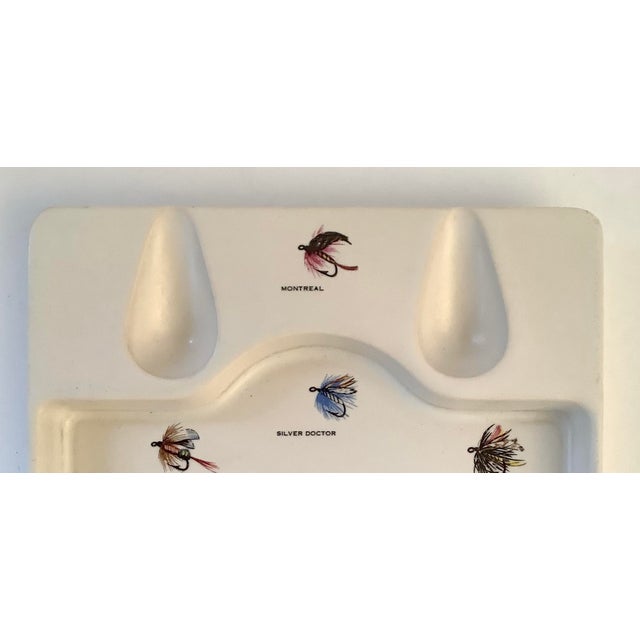 Mid-century smoking porcelain pipe tray manufactured by Hyalyn with fly fishing graphics. Eight different fishing flies...