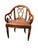 A handsome pair of traditional-style walnut-finished armchairs with warm brown leather seats, decorative nailhead trim,...