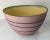 We are selling this cool looking mid-century modernist pottery bowl with matte pink surface and incised black swirl...