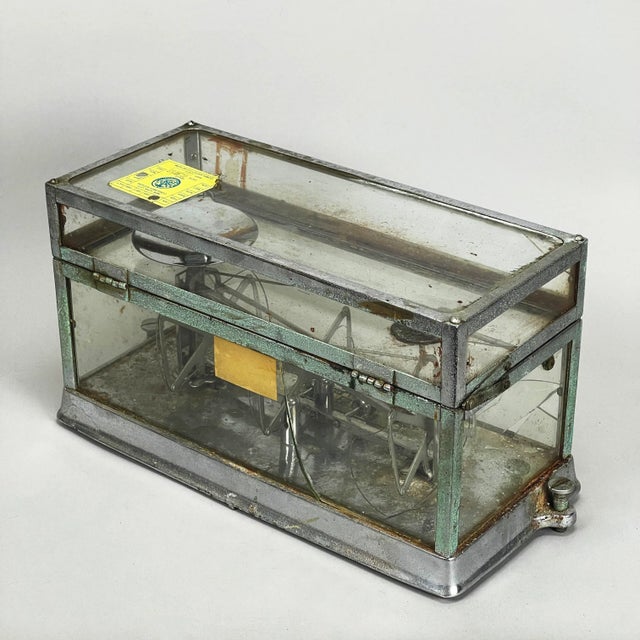 Beautifully distressed and weathered antique apothecary scale housed within a hinged glass case. This scale is not...