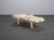 A rare belgian coffee table from the 1970s, defined by an architectural composition of layered natural stone elements. The...