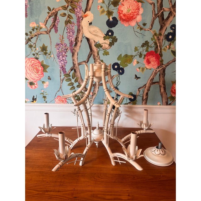 Listing is for a vintage 6 light white tole faux bamboo chandelier with pagoda form accented with brush reeds. The...