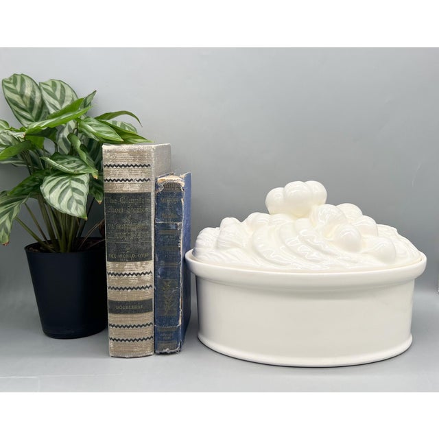 Captivating, sculptural vintage white ceramic lidded vegetable serving dish featuring a wonderfully detailed overflowing...