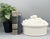 Captivating, sculptural vintage white ceramic lidded vegetable serving dish featuring a wonderfully detailed overflowing...