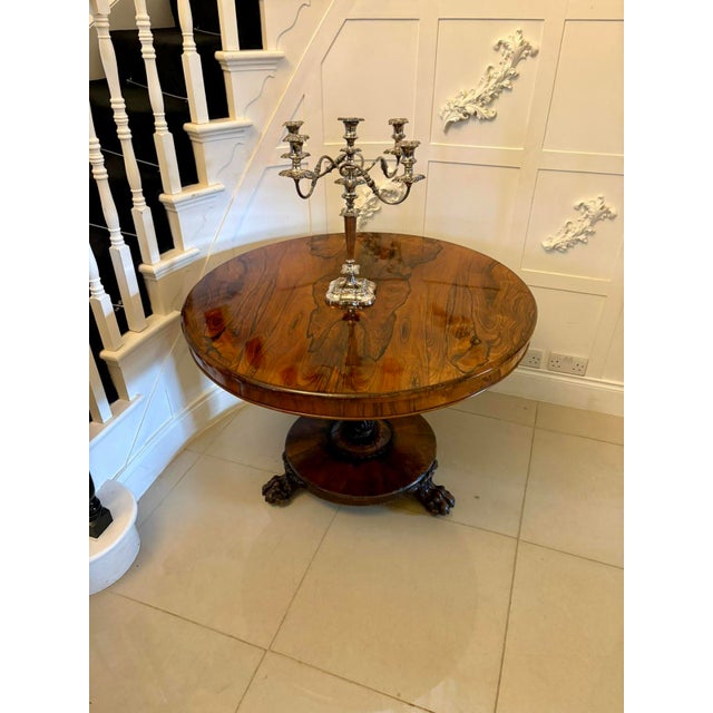 An exceptional William IV circular dining table of superb quality, crafted in richly figured rosewood of remarkable depth...