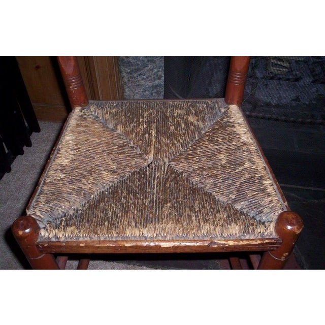 1920-30 wooden ladderback side chair, red maple stain with woven seat. The chair with its simple design adds a Primitive...