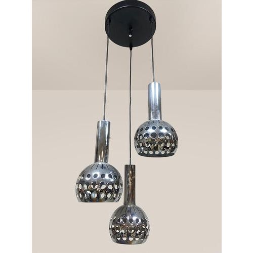 This chrome-plated metal cascade lamp with three shades, model "Symphonie," was produced in the 1970s by Euroline in...