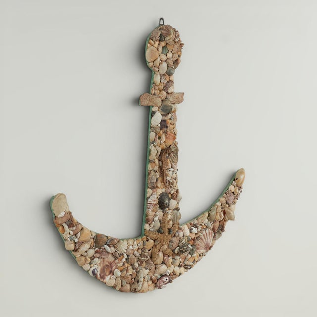 Charming wall hanging in the form of a ship's anchor, ambitiously crafted with exotic seashell highlighted with a seahorse...