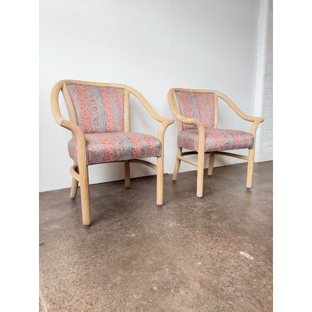 A pair of vintage McGuire arm chairs or accent chairs circa 1980s. Super solid and can be used as accent or dining chairs...