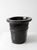 An antique Chinese coopered wood basin featuring a black lacquer finish, thick flared rim, and hand-carved braided bands....