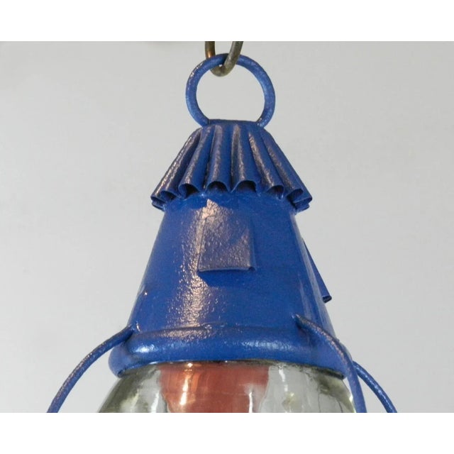 An original ship's oil lantern that has been converted to electricity, which can be used either as a table lamp or hanging...