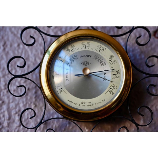 This wall barometer, produced by SFAM (Société Française d'Appareils Météorologiques), dates from the 1970s. The case is...