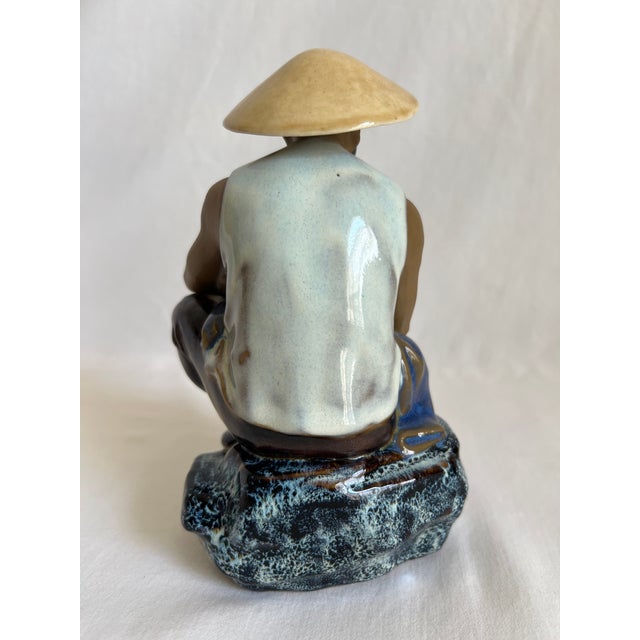 This is a Chinese Mudman figurine, also known as a Shiwan Mudman, which is a type of collectible ceramic figure. Mudmen...
