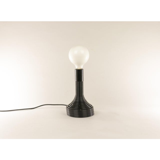 Playful “Spirale” table lamp designed by Angelo Mangiarotti and manufactured by Candle, Milano in the 1970s. The switch of...