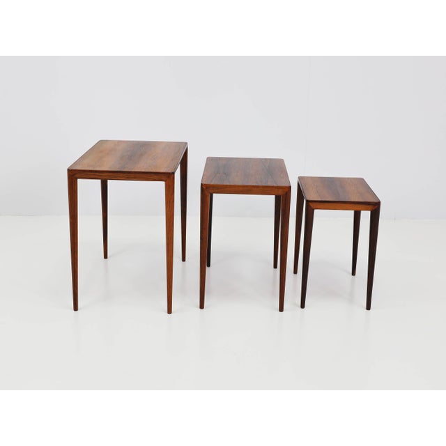 57 x 36 x HT 52 cm | 47 x 31 x HT 47 cm | 37.5 x 26 x 41 cm. Pieces in Santos rosewood. This piece has an attribution...
