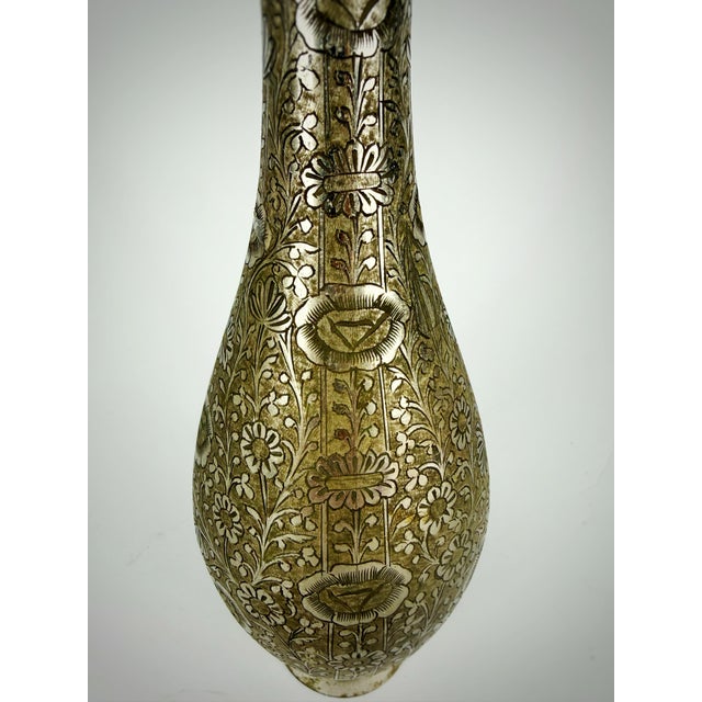 A beautifully hand-engraved vintage silver-tone metal vase, handcrafted in India circa 1965–1980. This elegant trumpet-...