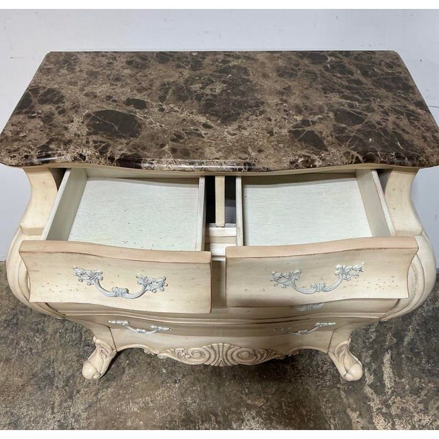 This French Provincial-style bombe chest brings serious drama to a bedroom, entryway, or living room — the swelling...
