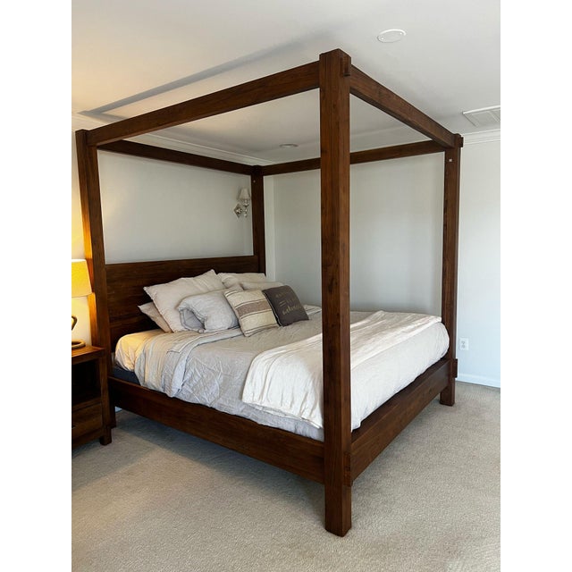 Pottery Barn Menlo Canopy King bed frame. Crafted of reclaimed teak, it brings rustic warmth to a bedroom. The wood...