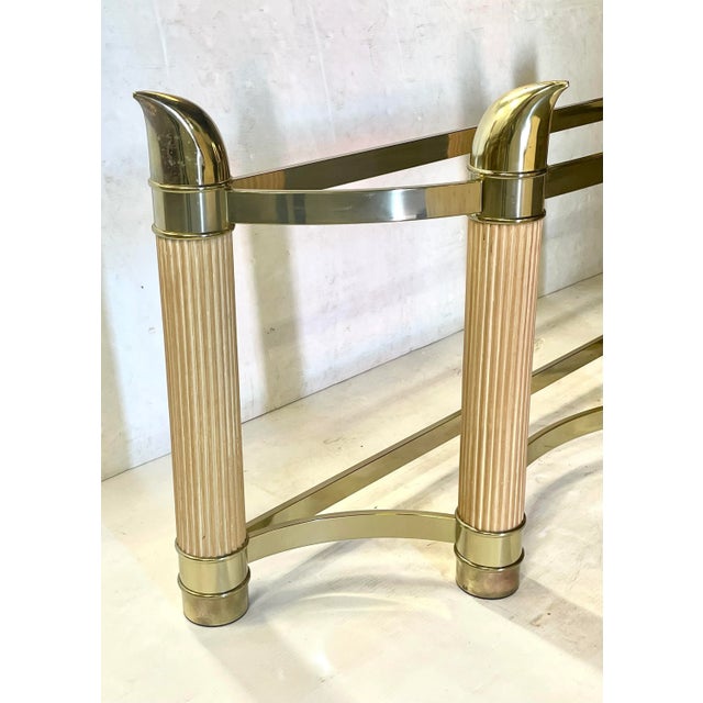 Vintage 1970's. The classic elephant trunk design after Tommaso Barbi. Brass & wood in a Demilune form. Measures 27" x 15"...