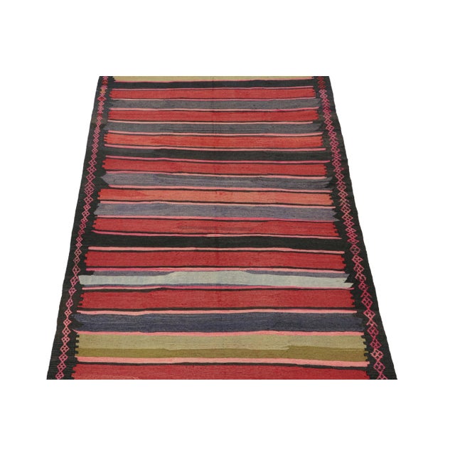 This vintage 6x10 Persian Kilim is a mid-century tribal rug that we believe originates from the Shahsavan tribe. On the...