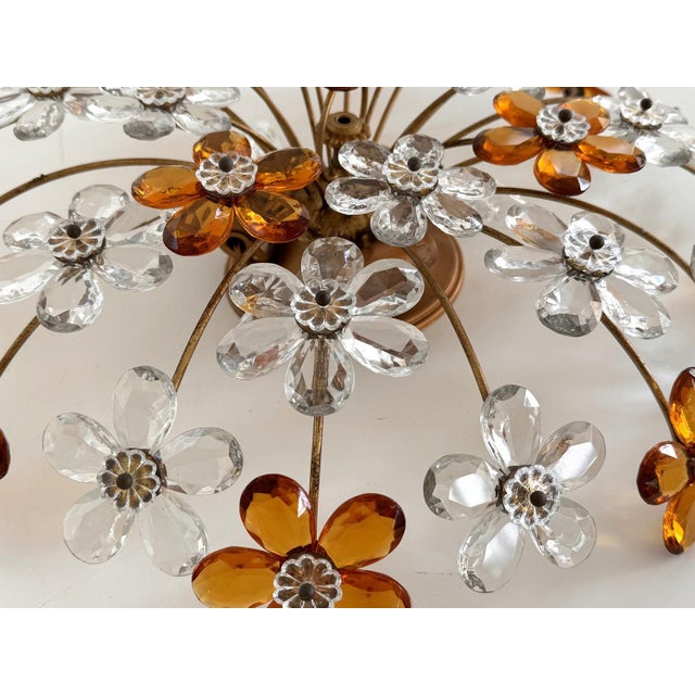 Gorgeous round shaped flush mount light made of golden varnished metal base on which are mounted 32 pieces of Murano...