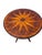A distinctive vintage Uttermost round bistro table featuring a richly figured wood-veneer top centered by a dramatic...