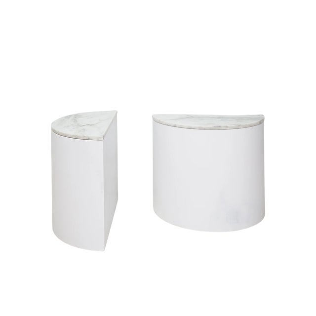 Sleek and full of surprises, this pair of end tables offers a mix of geometric minimalism and organic luxury all in one....