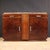 French sideboard from the 1930s. This Art Deco furniture is carved and veneered in walnut and burl. It features two doors...