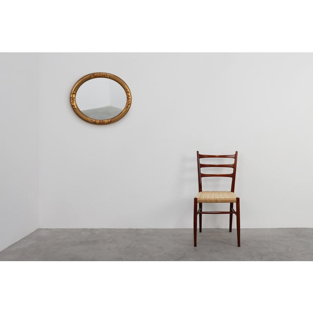 This Belgian Art Deco mirror from the 1920s embodies the refined geometry and warm materiality characteristic of the...