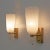 Beautiful set of two stunning brass wall lamps made with brass base and white "pulegoso" blown murano glass glasses in the...