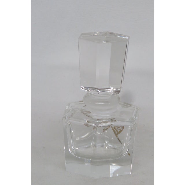 This lovely vintage perfume bottle is made out of glass. We believe this piece is a vintage Czech / Bohemian perfume...