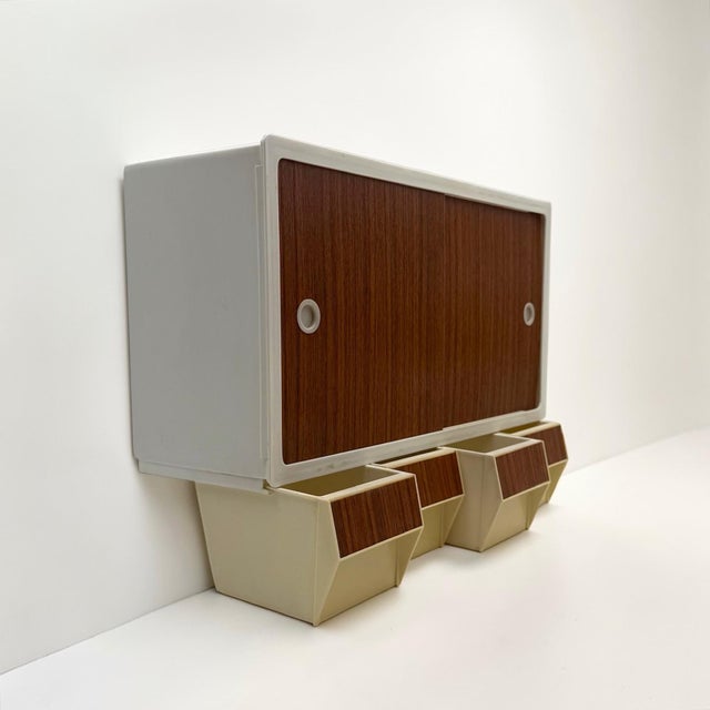 Produced in Holland during the 1970s, this Curver plastic wall cabinet represents the functional charm of everyday design...