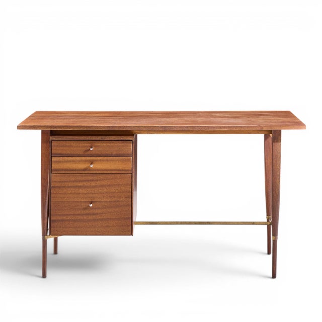 Paul McCobb for Calvin Mid Century Mahogany and Brass Desk This desk measures: 54 wide x 26 deep x 29 high, with a chair...