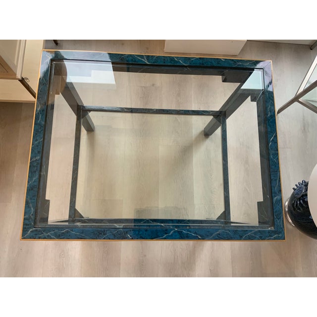 The Decker console table by Chelsea House is crafted from lacquered wood hand finished in a gorgeous blue marble pattern...