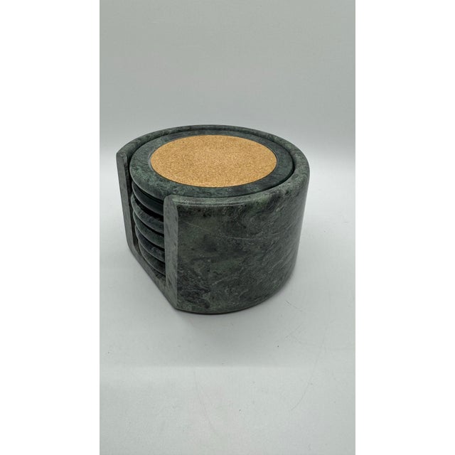 Rendered in a deep, variegated jade green marble, these coasters feature beautiful natural veining that ensures no two...