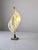 This sculptural table lamp by Maison Rougier embodies the sophistication of 1970s Canadian Hollywood Regency style. The...