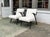 A great pair of vintage wooden armchairs newly upholstered in off-white boucle. Bentwood arms have original black paint...