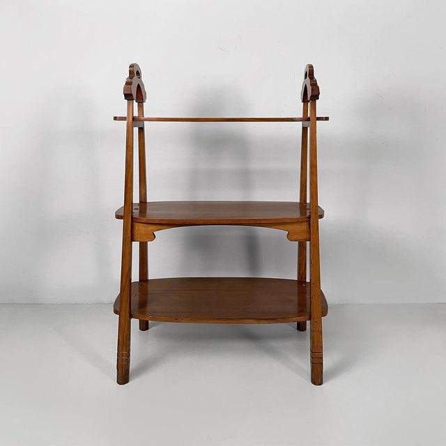 Italian antique whatnot or coffe table in wood, early 1900s Wooden etagere or coffee table with three shaped shelves of...