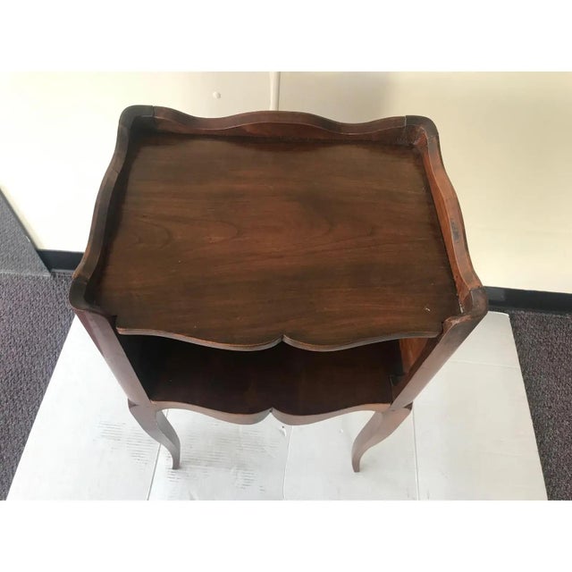 This Classic French side table is elegant and handsome providing table top space next to a bed or sofa.