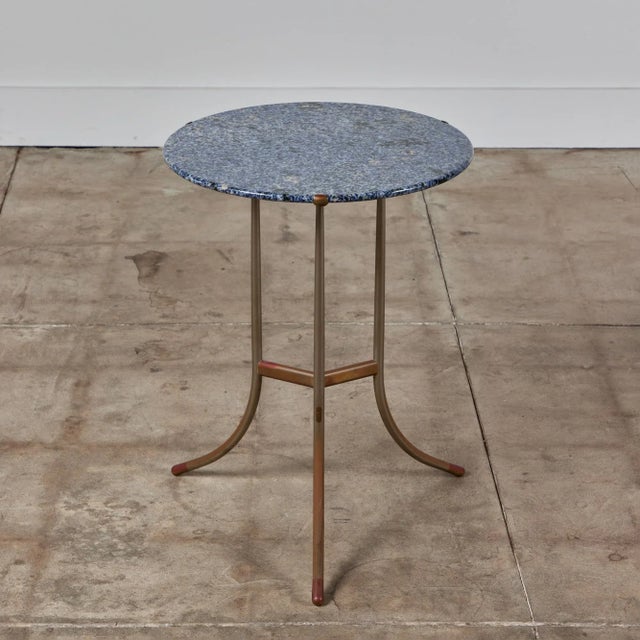 Cedric Hartman mixed metal and granite side table, c.1970s, USA. The round striking blue granite stone table top showcases...