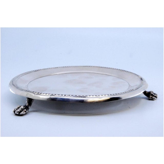 Silver Tray with Raised Frieze Edge and Claw-Shaped Feet, in Very Good conditions. Designed before 1890 This piece has an...