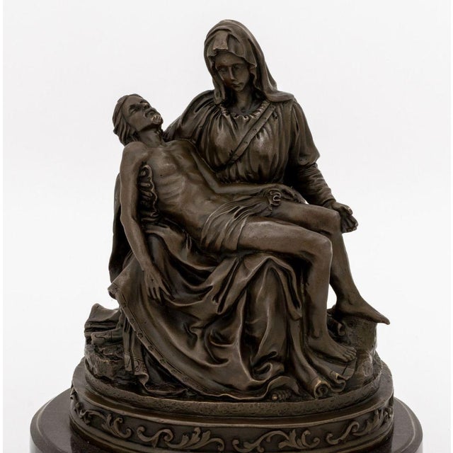 "La Pieta di Michelangelo" Patinated Bronze Sculpture, signed "Vally" to base, atop a black marble plinth. Overall: 10" H...