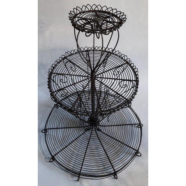 Beautiful Vintage French style tiered display rack. Perfect for all types of displays from plants to pastries.