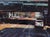 Long Shadows by Jim Beckner | Oil on Panel Painting of a city street with cars and shadows. For Sale